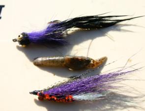 It pays to match the hatch. Here are some yabby imitation flies and the real thing in the middle.